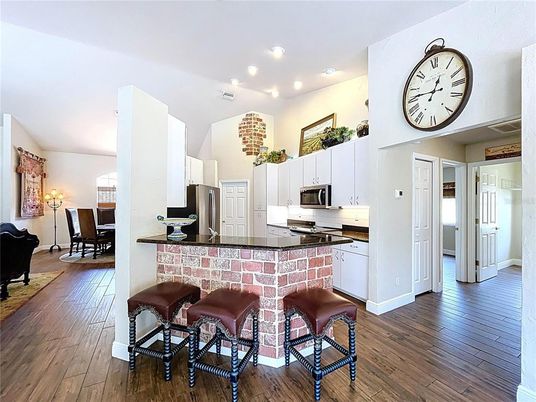 Dining room, Interior, Kitchen, Recessed Lighting, Stainless Steel Appliances, Wood Texture Flooring