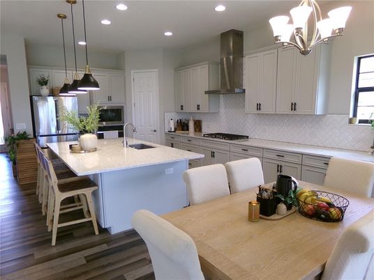 Dining room, Interior, Kitchen, Pendant Lights, Recessed Lighting, Stainless Steel Appliances, Wood Texture Flooring