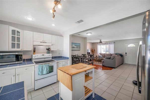 Dining room, Interior, Kitchen, Living room, Recessed Lighting, Stainless Steel Appliances, Tile Countertops