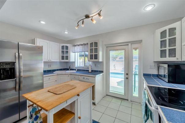 Interior, Kitchen, Recessed Lighting, Stainless Steel Appliances, Tile Countertops