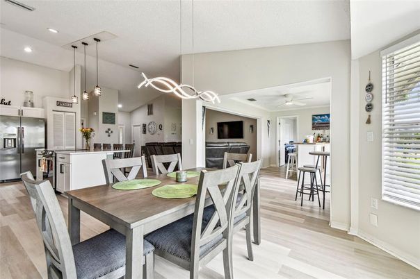 Dining room, Interior, Kitchen, Pendant Lights, Recessed Lighting, Stainless Steel Appliances, Wood Texture Flooring