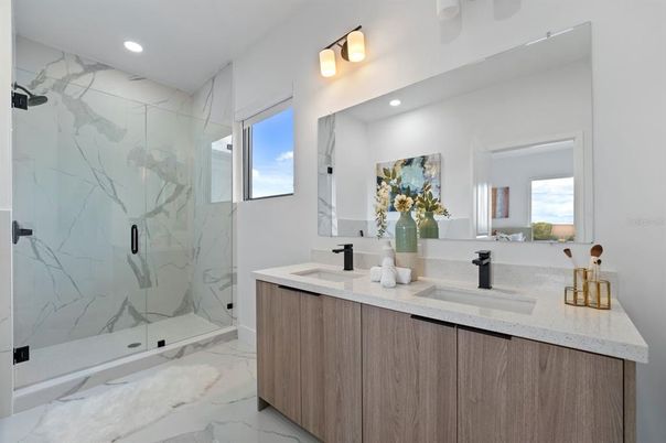 Bathroom, Dual Sink Vanities, Glass Shower, Interior, Marble, Marble Walls, Recessed Lighting