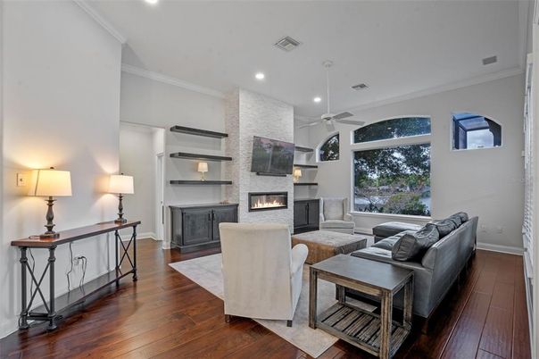 Fireplace, Interior, Living room, Recessed Lighting, Stone Walls, Wood Texture Flooring