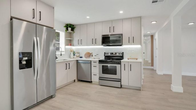 Interior, Kitchen, Recessed Lighting, Stainless Steel Appliances, Wood Texture Flooring