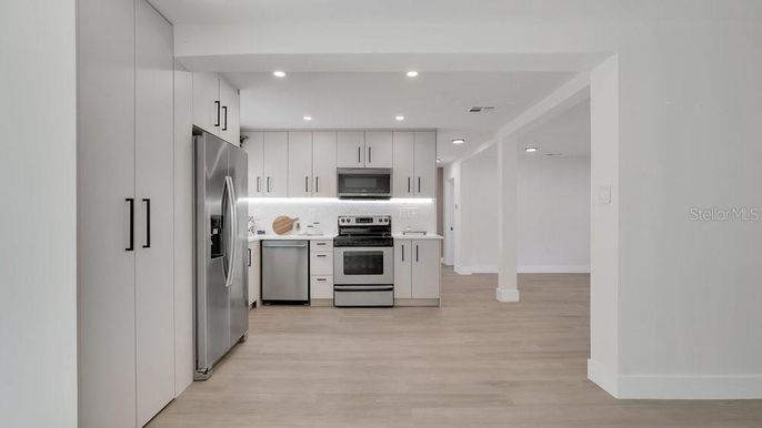 Interior, Kitchen, Recessed Lighting, Stainless Steel Appliances, Wood Texture Flooring