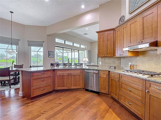 Dining room, Interior, Kitchen, Pendant Lights, Recessed Lighting, Stainless Steel Appliances, Wood Texture Flooring