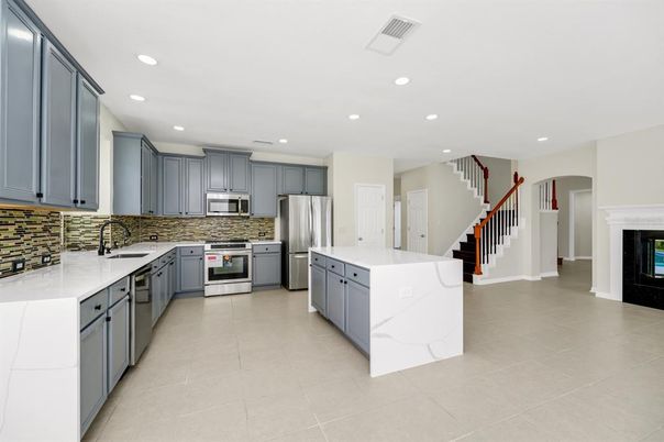Fireplace, Interior, Kitchen, Recessed Lighting, Stainless Steel Appliances