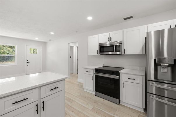 Interior, Kitchen, Recessed Lighting, Stainless Steel Appliances, Wood Texture Flooring