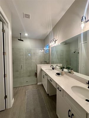 Bathroom, Dual Sink Vanities, Glass Shower, Interior, Recessed Lighting, Wood Texture Flooring
