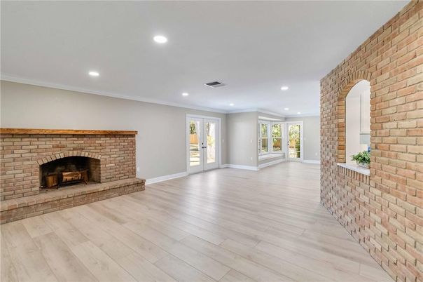 Empty room, Fireplace, Interior, Recessed Lighting, Stone Walls, Wood Texture Flooring