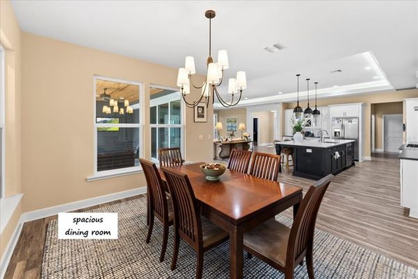 Chandelier, Dining room, Interior, Kitchen, Pendant Lights, Recessed Lighting, Stainless Steel Appliances, Wood Texture Flooring