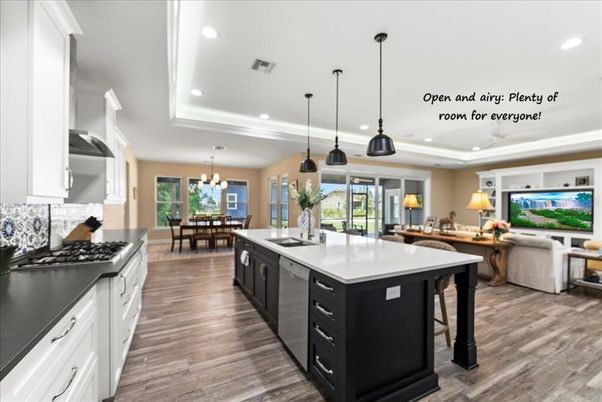 Chandelier, Dining room, Interior, Kitchen, Living room, Pendant Lights, Recessed Lighting, Stainless Steel Appliances, Wood Texture Flooring