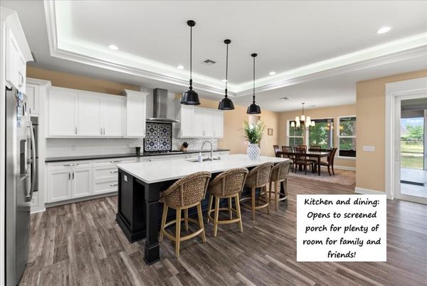 Chandelier, Dining room, Interior, Kitchen, Pendant Lights, Recessed Lighting, Stainless Steel Appliances, Wood Texture Flooring