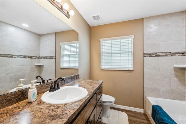 Bathroom, Dual Sink Vanities, Interior, Recessed Lighting, Wood Texture Flooring