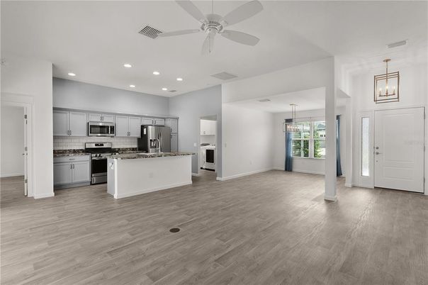 Empty room, Interior, Kitchen, Pendant Lights, Recessed Lighting, Stainless Steel Appliances, Wood Texture Flooring
