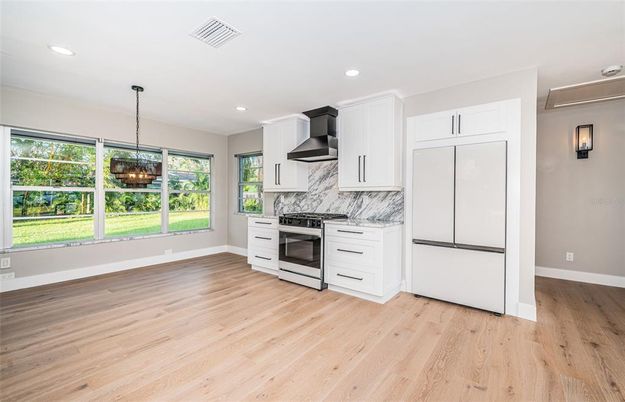 Fireplace, Interior, Kitchen, Marble Walls, Pendant Lights, Recessed Lighting, Wood Texture Flooring