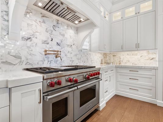 Interior, Kitchen, Marble Walls, Recessed Lighting, Stainless Steel Appliances, Wood Texture Flooring