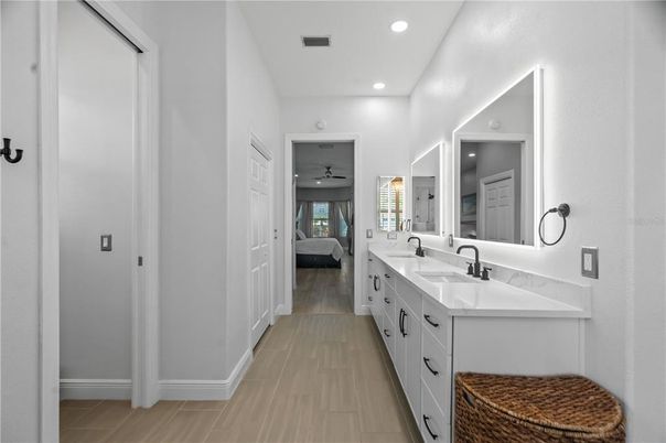 Bathroom, Bedroom, Dual Sink Vanities, Interior, Recessed Lighting, Wood Texture Flooring