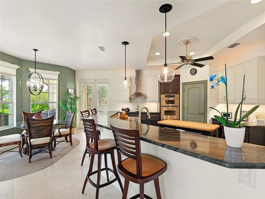 Chandelier, Dining room, Interior, Kitchen, Pendant Lights, Recessed Lighting, Stainless Steel Appliances