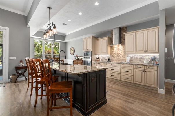 Dining room, Interior, Kitchen, Pendant Lights, Recessed Lighting, Stainless Steel Appliances, Wood Texture Flooring