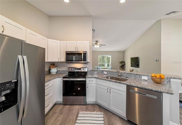 Interior, Kitchen, Recessed Lighting, Stainless Steel Appliances, Wood Texture Flooring