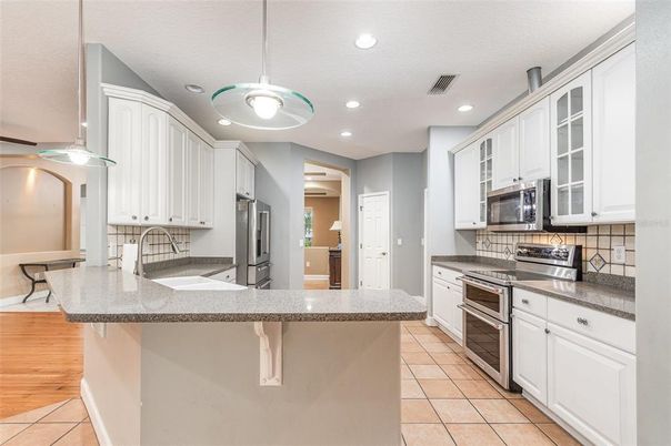 Interior, Kitchen, Pendant Lights, Recessed Lighting, Stainless Steel Appliances, Wood Texture Flooring