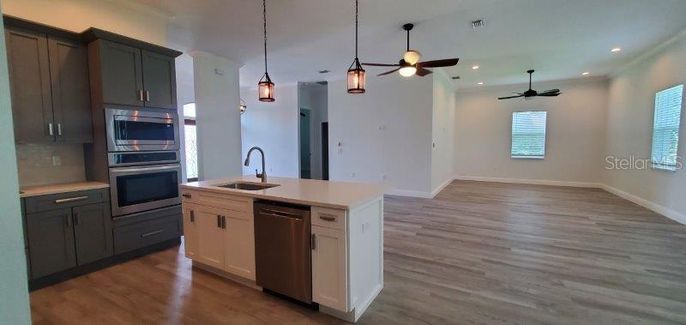 Interior, Kitchen, Pendant Lights, Recessed Lighting, Stainless Steel Appliances, Wood Texture Flooring