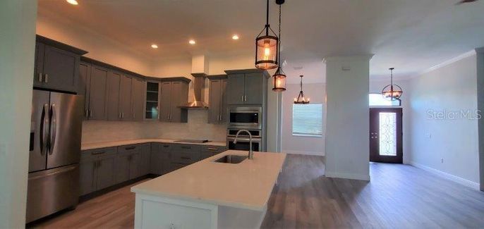 Chandelier, Interior, Kitchen, Pendant Lights, Recessed Lighting, Stainless Steel Appliances, Wood Texture Flooring