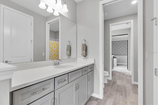 Bathroom, Dual Sink Vanities, Interior, Recessed Lighting, Wood Texture Flooring