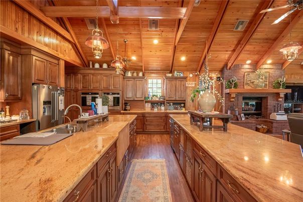 Fireplace, Interior, Kitchen, Living room, Pendant Lights, Recessed Lighting, Stainless Steel Appliances, Stone Walls, Wooden Beams, Wooden Ceilings, Wood Texture Flooring