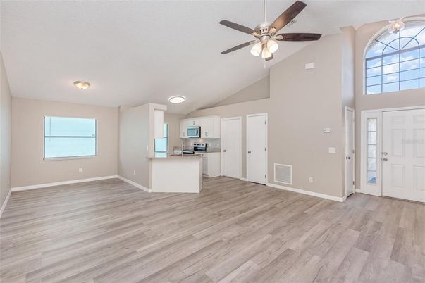 Empty room, Interior, Kitchen, Stainless Steel Appliances, Wood Texture Flooring