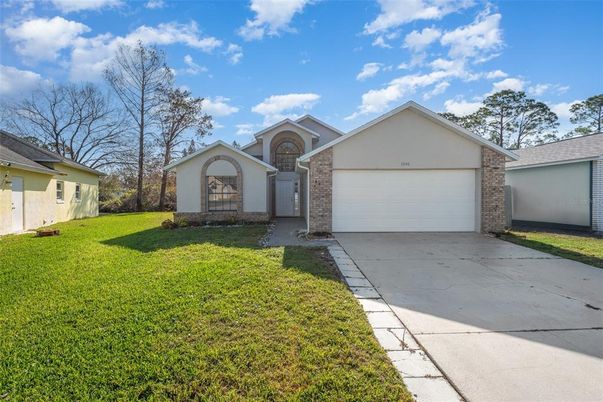 Attached, Backyard, Exterior, Facade, Brick Facade, Ranch