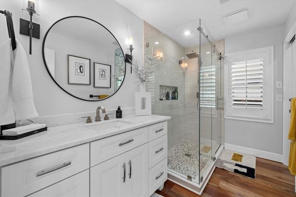 Bathroom, Dual Sink Vanities, Glass Shower, Interior, Recessed Lighting, Wood Texture Flooring