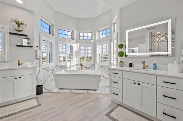 Bathroom, Dual Sink Vanities, Free Standing Baths, Interior, Marble, Recessed Lighting, Wood Texture Flooring