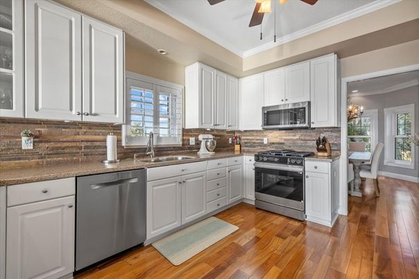Chandelier, Dining room, Interior, Kitchen, Stainless Steel Appliances, Wood Texture Flooring