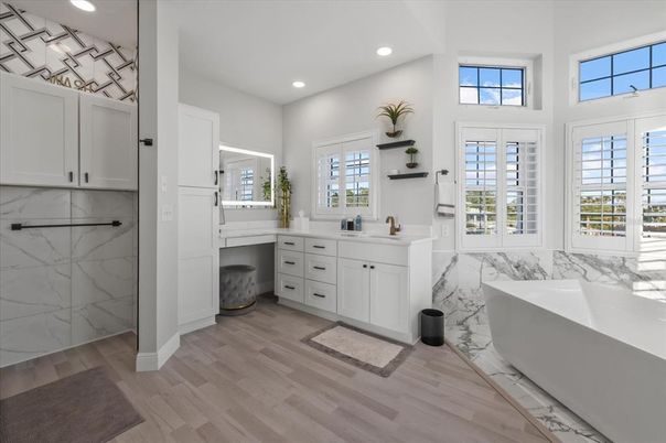 Bathroom, Dual Sink Vanities, Free Standing Baths, Interior, Marble Walls, Recessed Lighting, Wood Texture Flooring