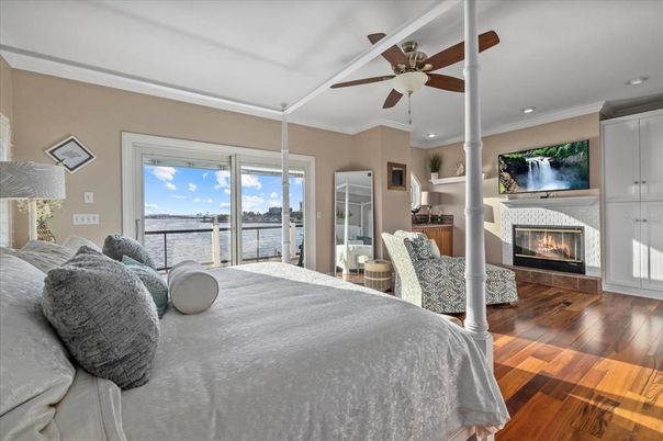 Bedroom, Fireplace, Interior, Recessed Lighting, Water, Wood Texture Flooring