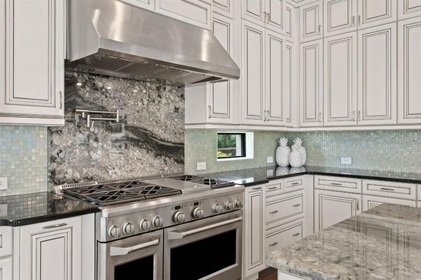 Chandelier, Interior, Kitchen, Living room, Recessed Lighting, Stainless Steel Appliances, Wood Texture Flooring