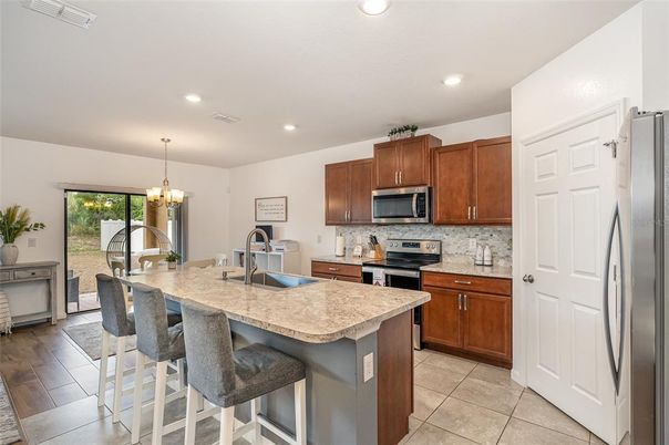 Chandelier, Interior, Kitchen, Recessed Lighting, Stainless Steel Appliances, Wood Texture Flooring