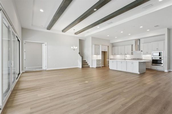 Chandelier, Interior, Kitchen, Pendant Lights, Recessed Lighting, Stainless Steel Appliances, Wooden Beams, Wood Texture Flooring