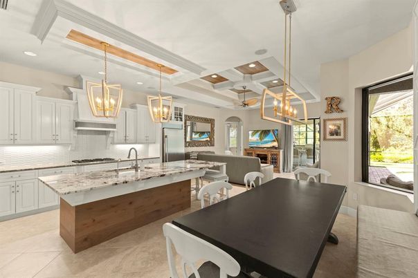 Chandelier, Dining room, Fireplace, Interior, Kitchen, Living room, Pendant Lights, Recessed Lighting, Stainless Steel Appliances