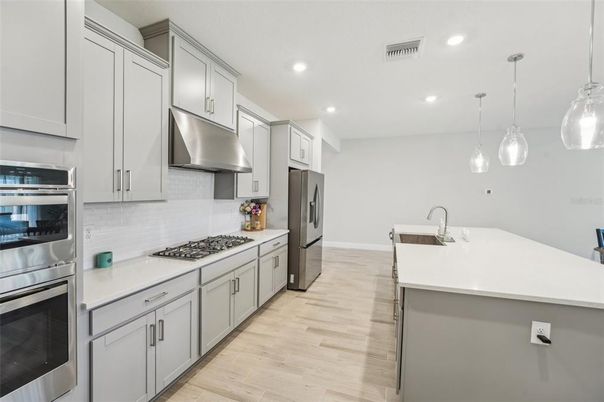 Interior, Kitchen, Pendant Lights, Recessed Lighting, Stainless Steel Appliances, Wood Texture Flooring