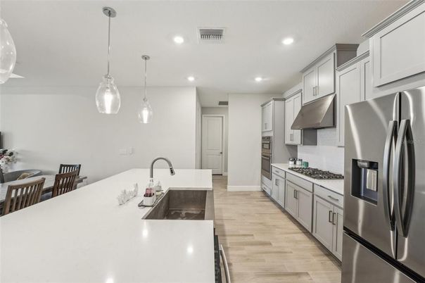 Interior, Kitchen, Pendant Lights, Recessed Lighting, Stainless Steel Appliances, Wood Texture Flooring