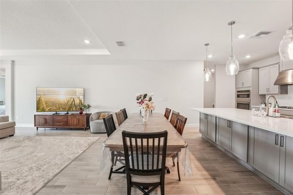 Dining room, Interior, Kitchen, Living room, Pendant Lights, Recessed Lighting, Stainless Steel Appliances, Wood Texture Flooring