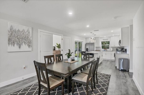 Dining room, Interior, Kitchen, Pendant Lights, Recessed Lighting, Stainless Steel Appliances, Wood Texture Flooring