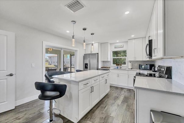 Interior, Kitchen, Pendant Lights, Recessed Lighting, Stainless Steel Appliances, Wood Texture Flooring