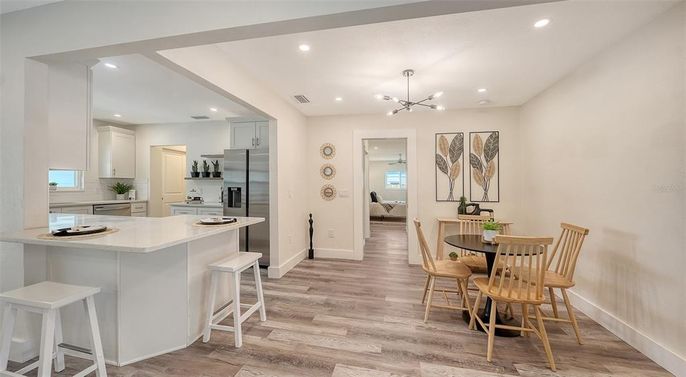Dining room, Interior, Kitchen, Pendant Lights, Recessed Lighting, Stainless Steel Appliances, Wood Texture Flooring