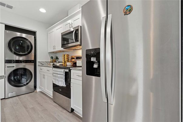 Interior, Kitchen, Recessed Lighting, Stainless Steel Appliances, Washer, Wood Texture Flooring