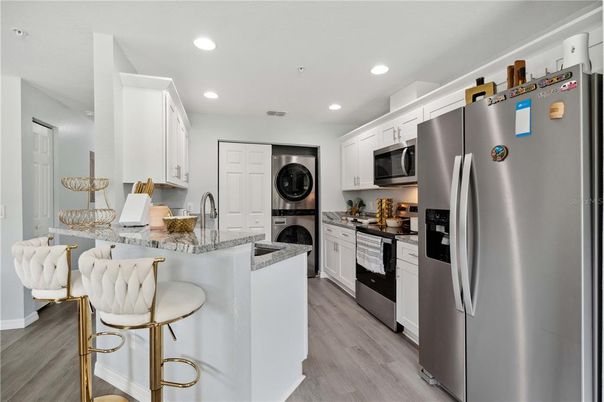 Interior, Kitchen, Recessed Lighting, Stainless Steel Appliances, Washer, Wood Texture Flooring