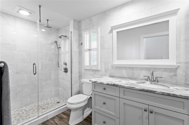 Bathroom, Glass Shower, Interior, Marble Walls, Recessed Lighting, Wood Texture Flooring